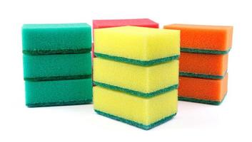 Several multi-colored sponges isolated on a white background. Sponge for washing dishes . photo