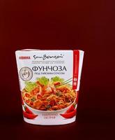 KRASNOYARSK, RUSSIA - OCTOBER 10, 2022 Fast food in box. Funchoza with Thai sauce. Thai food. photo