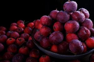 Full plate of fresh red apples. Mountain of ripe apples. photo