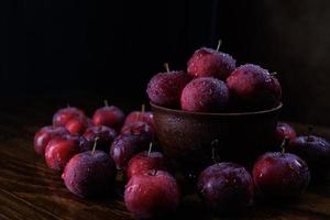 Clay plate with red apples. Red ripe apples. photo