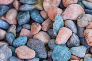 Natural bright colorful pebbles background. Mountain road pattern, walkway closeup photo