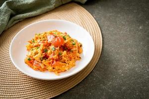 Stir-fried tomatoes with egg or Scrambled eggs with tomatoes photo