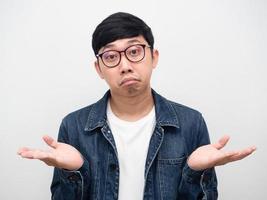 Man wearing glasses confused face gesture I don't know,Man jeans shirt doubt photo