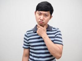 Portrait young man striped shirt serious thinking thoughtful photo