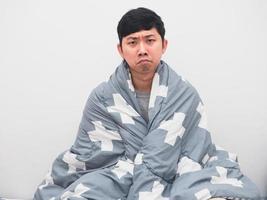 Man wake up at morning cover blanket his body feel bored about sleepless photo