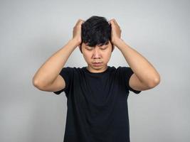 Asian man sadness hold his head portrait photo