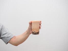 Hand holding bubble tea isolated photo