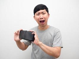 Man sadness with no money shake his wallet for find money photo
