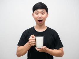 Young man holding milk glass excited emotion portrait photo