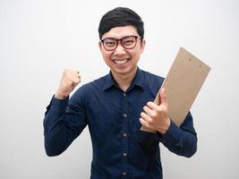 Asian businessman with document board cheerful fist up with successful photo