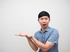 Man excited emotion gesture holding product,Man amazed show empty hand photo