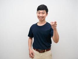 Man smiling point finger at you standing studio shot photo
