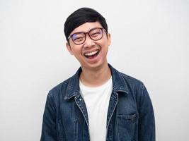 Portrait handsome man wearing glasses jeans shirt,Asian man glasses laugh studio shot photo