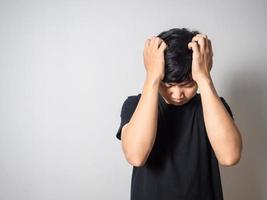 Depressed man hold head feels hopeless white background photo