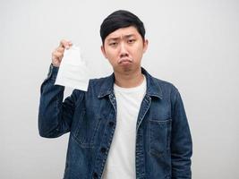 Sickness man jeans shirt tissue paper,Sadness face asian man photo