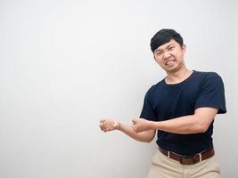 Young man gesture pull rope feel heavy isolated photo