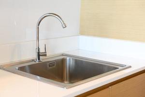 stainless steel kitchen sink in room photo