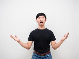 Asian man feels amazed looking above isolated photo