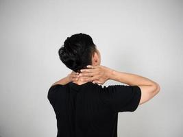 Man turn back gesture pain neck isolated