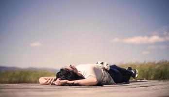 Lovely women by a lake at sunny day relaxing. photo