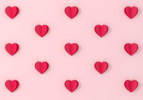 Símbolos de corazón rojo de origami sobre fondo rosa. foto