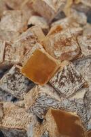 Turkish delight or lokum is a family of confections based on gel of starch and sugar photo