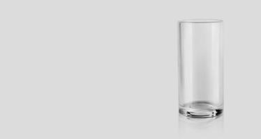 Empty glass isolated on grey background. 3d render photo