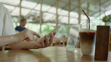 Woman use smartphone to scan QR code in cafe. The restaurant and hotel built a digital payment system without cash. Qr code pay, E wallet, cash technology, pay online video