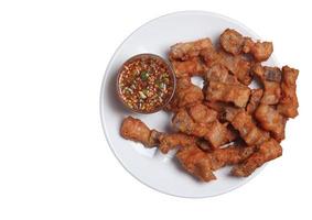 Fried pork with fish sauce on a white background photo