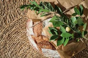 Top view of round freshly baked rustic rye bread. Christmas fair photo