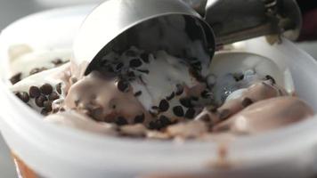 Close up of chocolate flavor ice cream in a container video