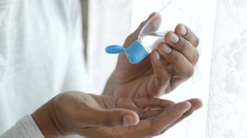 Young Man Using Sanitizer For Preventing Virus, Close Up video