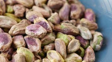 Detail shot of pistachios nut in a bowl video
