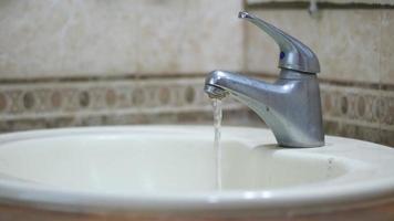 Close up of faucet with flowing water video