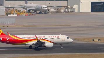 HONG KONG NOVEMBER 10, 2019 - Hongkong Airlines Airbus A320 B LPN climbing up in the air after take off from Hong Kong HKG. Passenger flight departure from Chek Lap Kok International Airport video