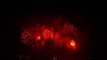 Beautiful big fireworks in the night city in honor of the celebration of Victory Day, New Year video