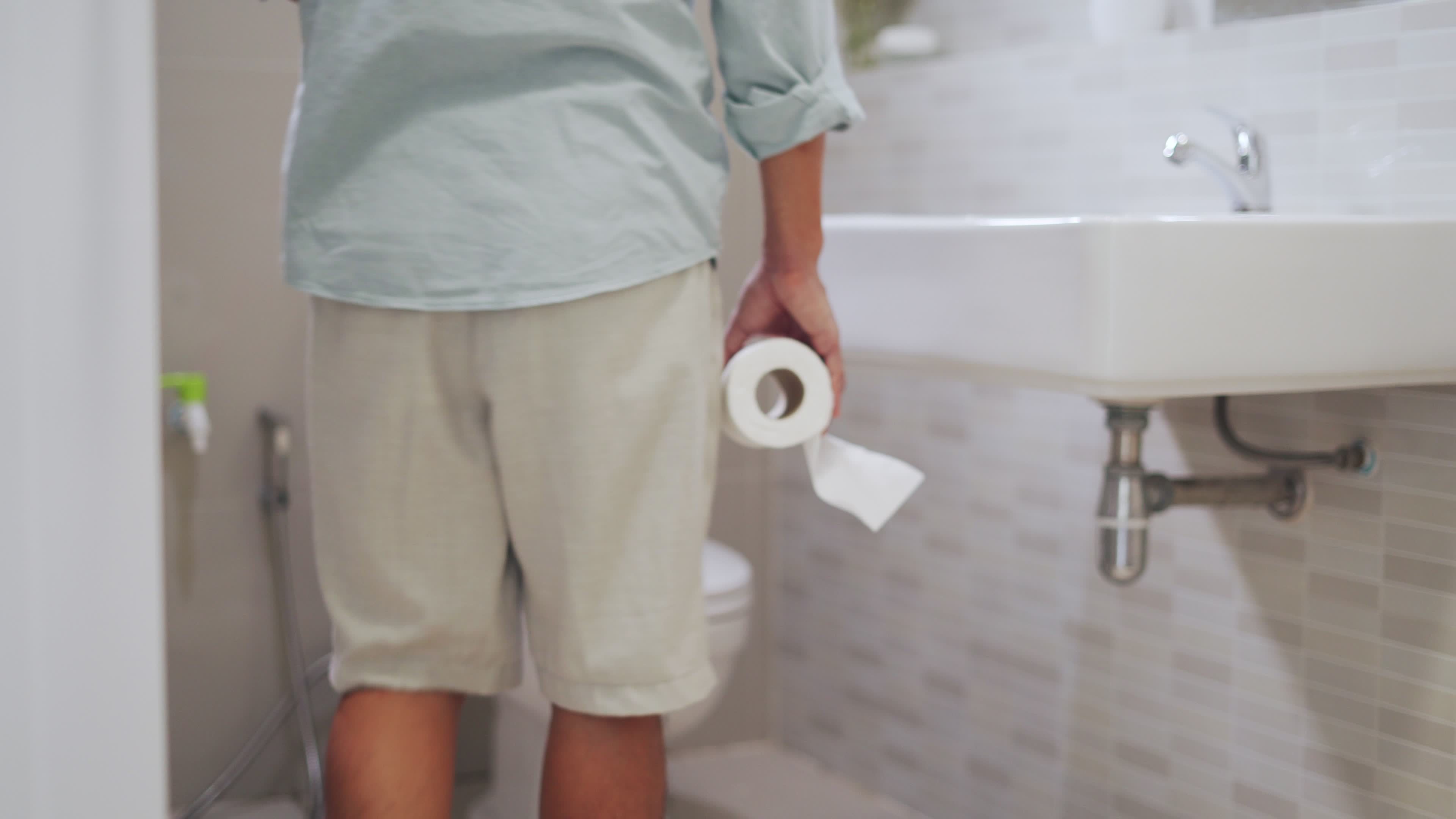 A man feeling his stomach with abdominal pain and use hand open the