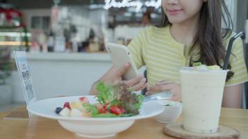 beautiful woman use smartphone to scan QR code in cafe. The restaurant built a digital payment system without cash. Qr code pay, E wallet, cash technology, pay online, online, digital transfer. video