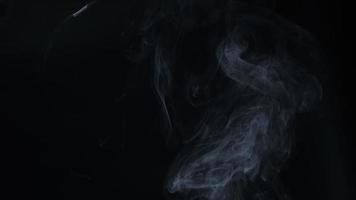 Slow motion of white smoke, fog, mist, vapor on a black background. video