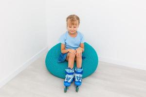 little girl roller skates at home photo