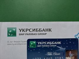 KYIV, UKRAINE - JANUARY 4, 2023 Offer of banking services and debit cards photo