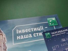 KYIV, UKRAINE - JANUARY 4, 2023 Offer of banking services and debit cards photo