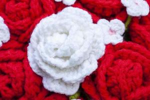 Crochet roses made from yarn for giving to those we love, Valentine's day for background. photo