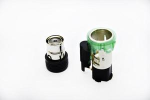 Cigarette lighter with green backlight. Spare part for the car. The electric cigarette lighter is disassembled. photo