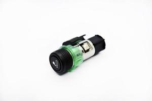Cigarette lighter with green backlight. Spare part for the car. The electric cigarette lighter is disassembled. photo