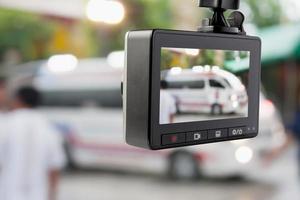 Car CCTV camera video recorder with ambulance car on the road photo