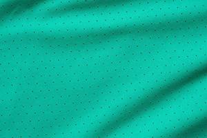 Green sports clothing fabric football shirt jersey texture background photo