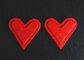 Love hearts on wooden texture background. Valentines day card concept. Heart for Valentines Day Background. photo