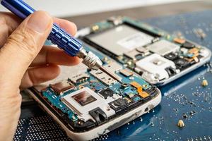 Repairing and upgrade mobile phone, electronic, computer hardware and technology concept. photo