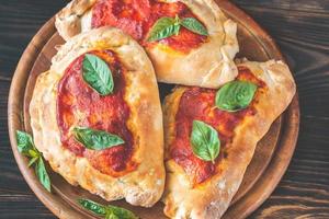 Homemade calzone flat lay photo